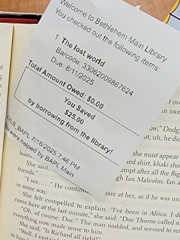 a receipt showing "you saved $25 by borrowing from the library today"